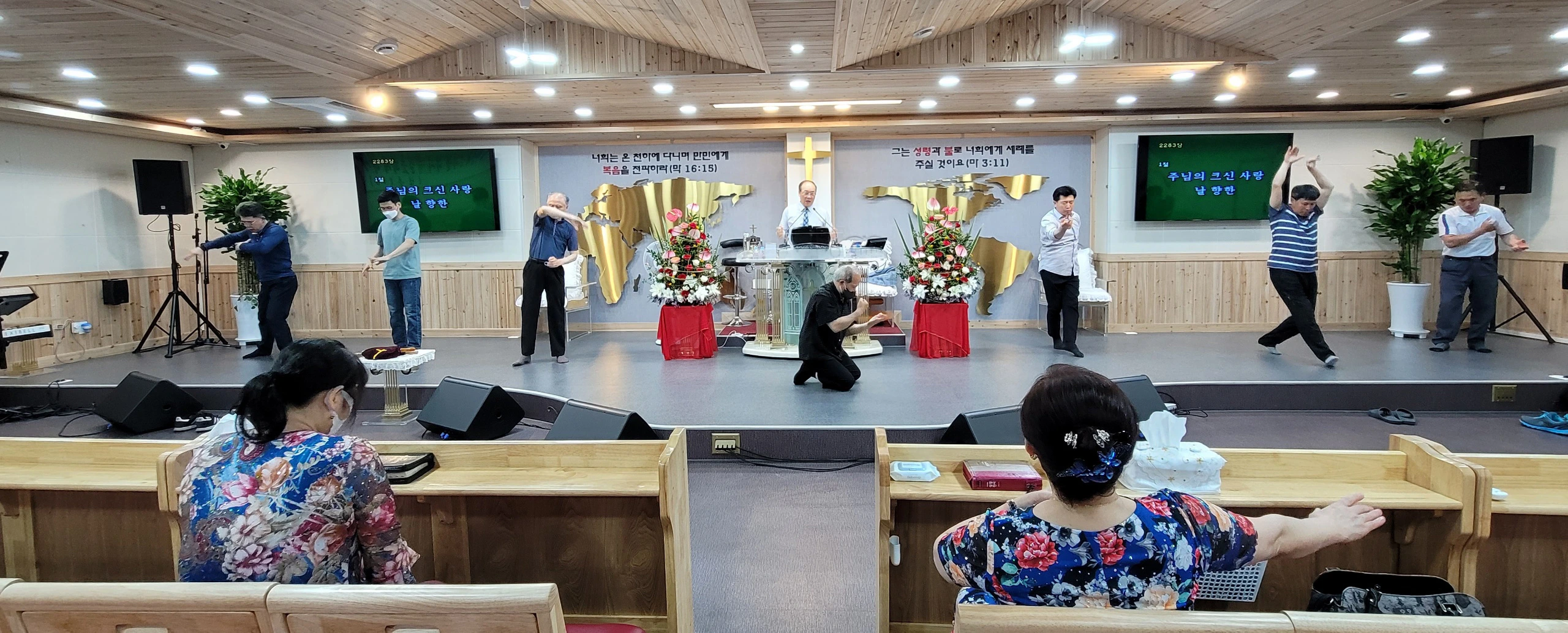 The men also dance before The Lord, as Pastor Yong Doo Kim is singing a song in Korean. The men also dance before The Lord, as Pastor Yong Doo Kim is singing a song in Korean.